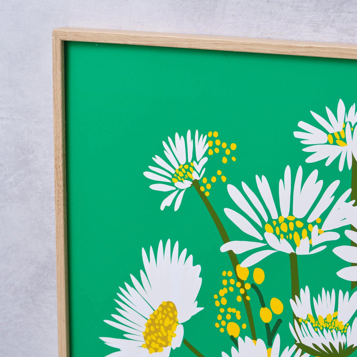 Close-up detail of the Daisy Vase fine art print by Kitty McCall showing white daisy blooms and yellow bud clusters on an emerald green background