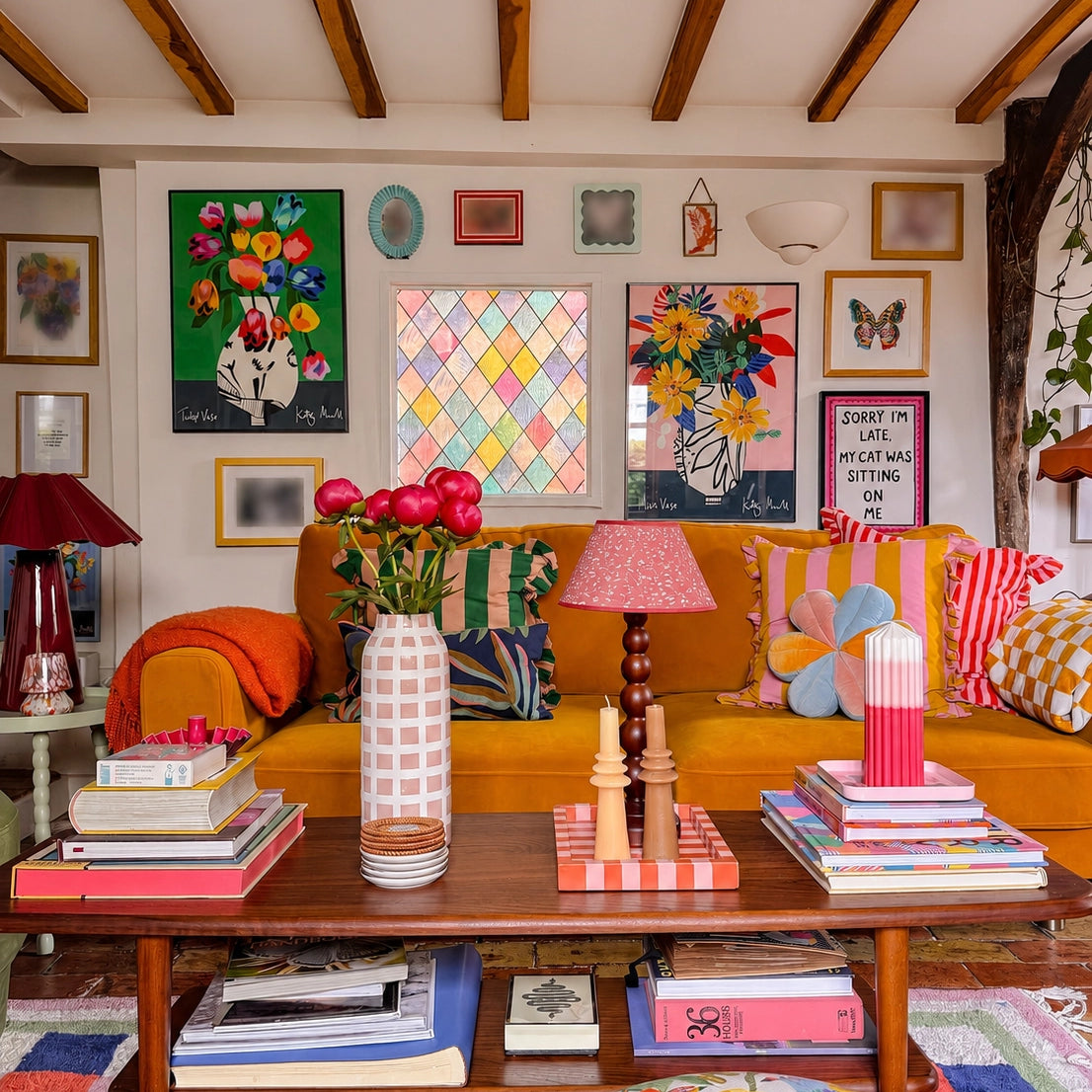 Miro Vase and Tulip Vase fine art prints by Kitty McCall displayed in a colourful eclectic living room with oak beams, mustard sofa and vibrant gallery wall