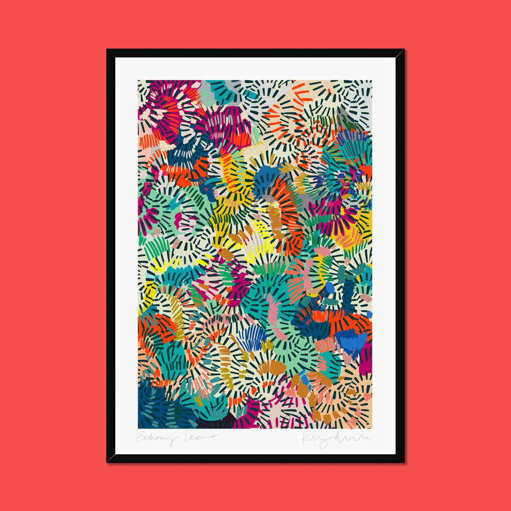 Framed colorful abstract art print on a red background