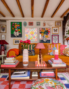 Miro Vase and Tulip Vase fine art prints by Kitty McCall displayed in a colourful eclectic living room with oak beams, mustard sofa and vibrant gallery wall