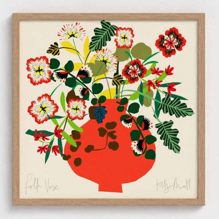 Framed artwork of a colorful floral arrangement in a red vase on a beige background