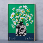 Daisy Vase fine art print by Kitty McCall in a natural oak frame, leaning against a grey wall