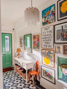 Kyoto Vase fine art print by Kitty McCall in a gold frame on a colourful hallway gallery wall alongside mixed artwork