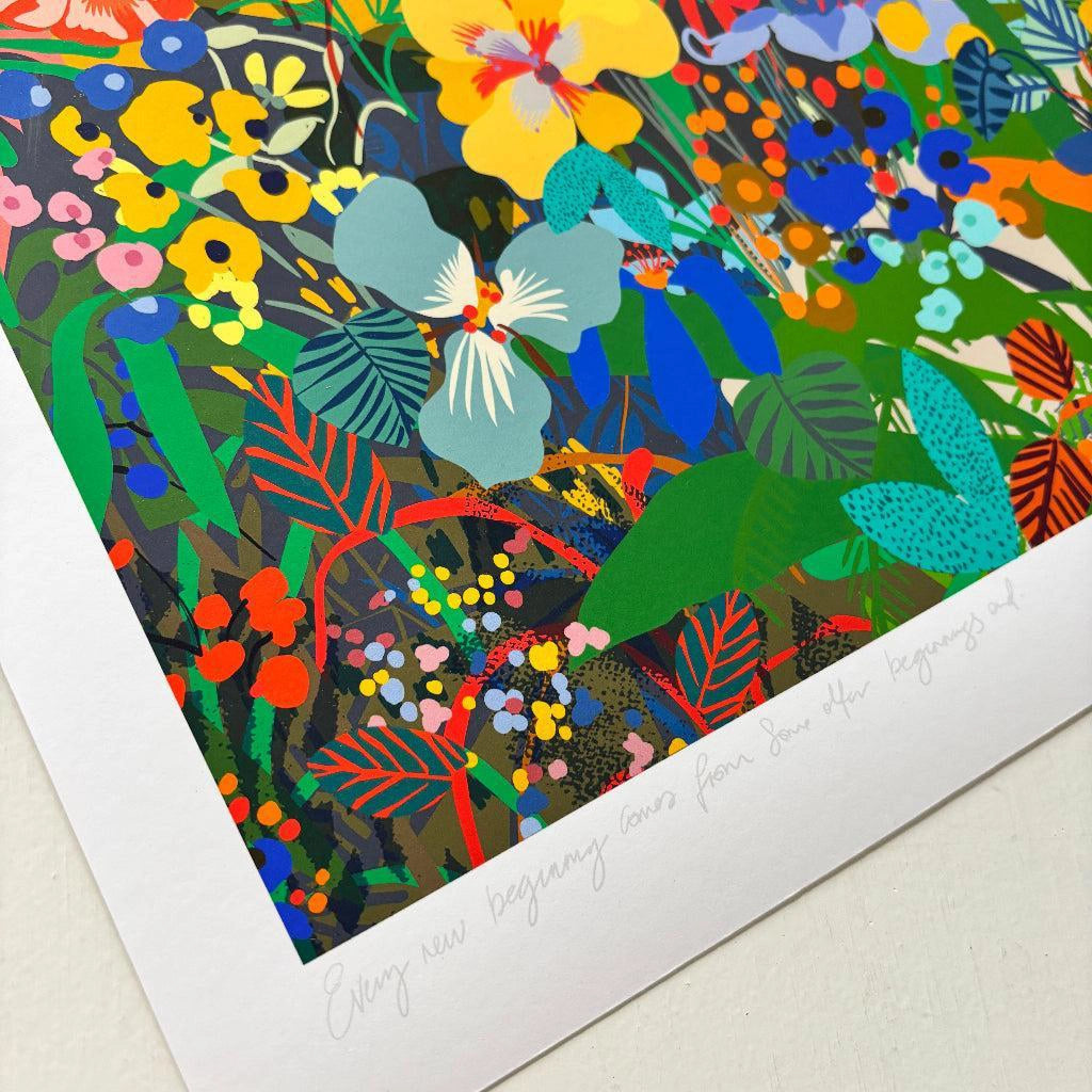 Close-up detail of the Stoic Landscape fine art print by Kitty McCall showing vivid blue, yellow and red wildflowers with the handwritten quote on the white border