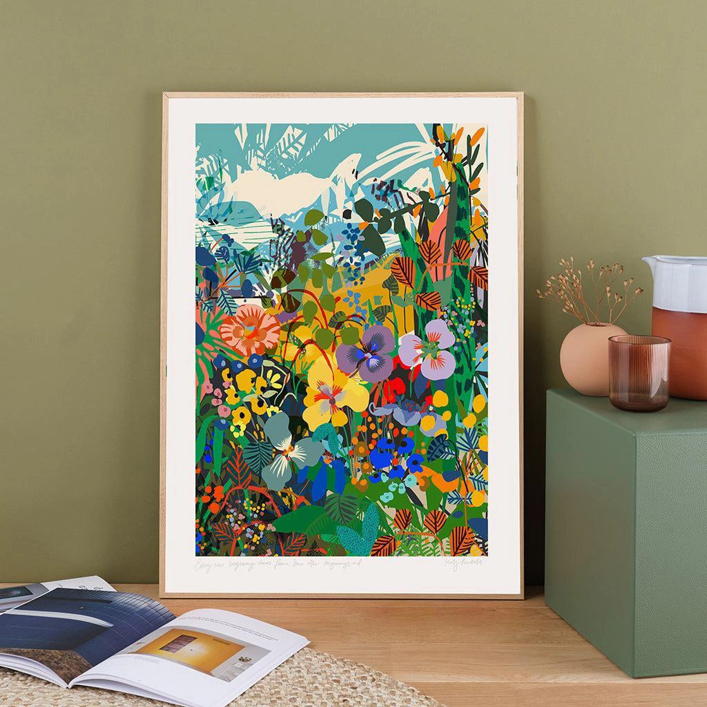Stoic Landscape fine art print by Kitty McCall in a natural oak frame, leaning against a sage green wall on a wooden sideboard styled with ceramics