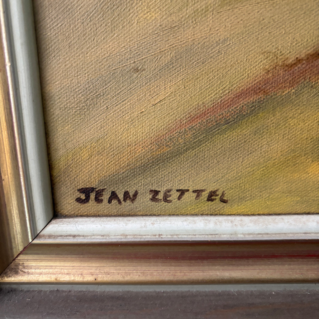 Close-up of a painting with 'Jean Zettel' signature on a textured surface.