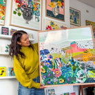 Catherine holding the Flowers of Utopia 80x80 cm framed botanical landscape art print by Kitty McCall