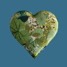Heart-shaped fabric heart with green leaf pattern on a gray background