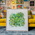 botanical-art-print-gallery-wall-yellow-sofa-living-room.jpg